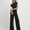 Svart ärmlös asymmetrisk draperad jumpsuit