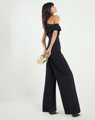 Svart ärmlös asymmetrisk draperad jumpsuit