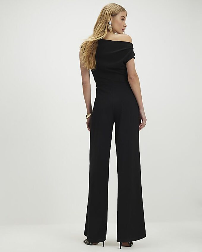 Svart ärmlös asymmetrisk draperad jumpsuit