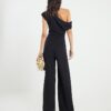 Svart ärmlös asymmetrisk draperad jumpsuit