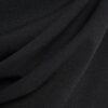 Svart ärmlös asymmetrisk draperad jumpsuit