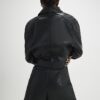 Svart skort i imitationsläder med öljettdetaljer
