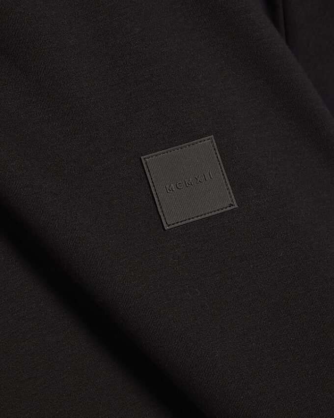 Svart slim fit-T-shirt med MCMXII-märke