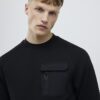 Svart slim fit-tröja i nylonhybrid