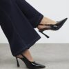Svart slingback-klack med logo