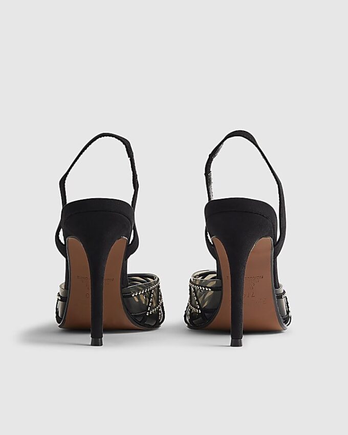 Svart slingback-klack med nitar i perspex