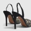 Svart slingback-klack med nitar i perspex