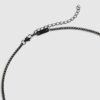 Svart stålhalsband med svart tagg