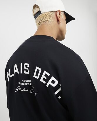 Svart T-shirt med oversized passform och Palais Dept-tryck