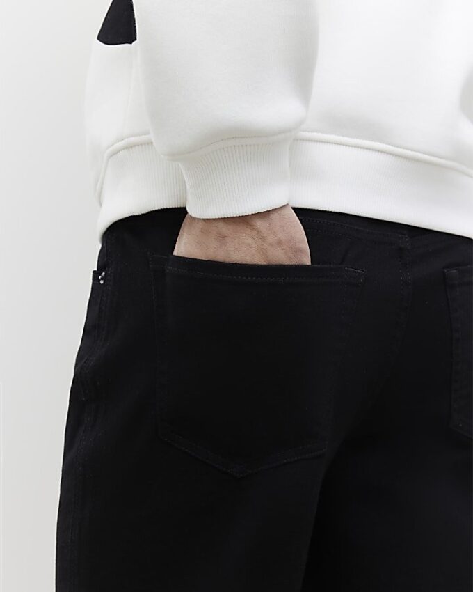 Svart tapered fit-jeans