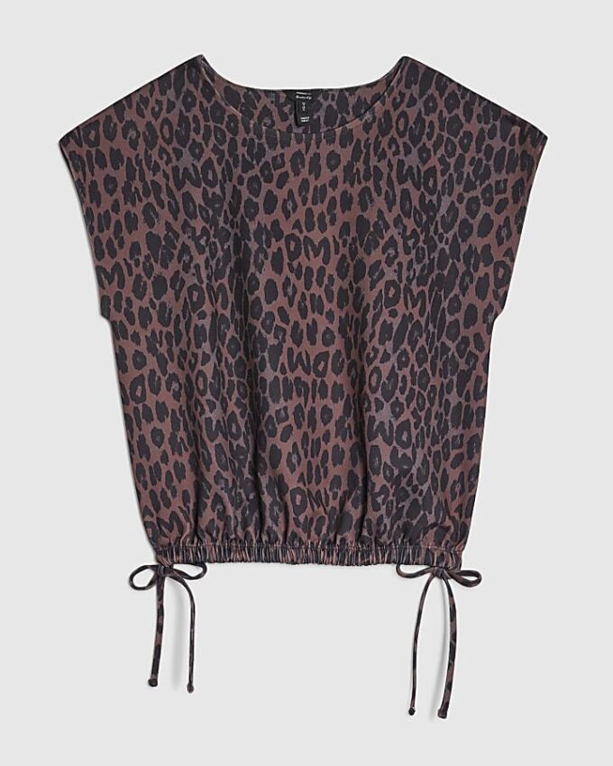 Svart topp med leopardmönster och knytband i sidorna
