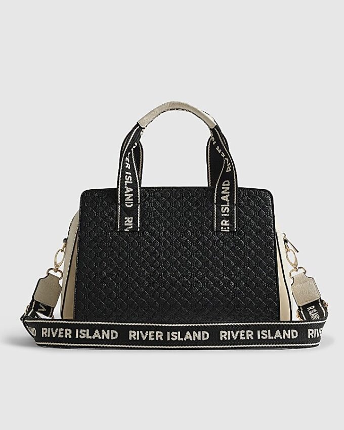 Svart totebag med monogram på framsidan