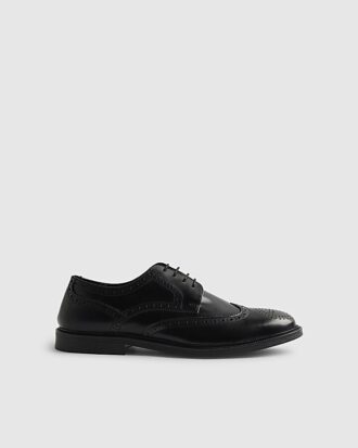 Svarta läderbrogues Svarta läderbrogues