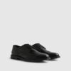 Svarta läderbrogues