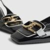 Svarta loafers med spänne och slingback-klack