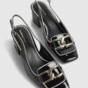 Svarta loafers med spänne och slingback-klack