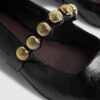 Svarta platta pumps med nitar