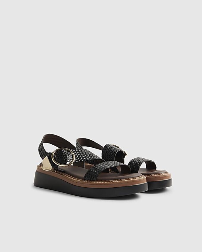 Svarta vävda sandaler med spänne och platt sula
