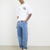 Vit oversized-passformad T-shirt med alpinbadge