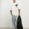 Vit oversized-passformad T-shirt med flera USA-märken