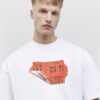 Vit oversized-passformad T-shirt med streckkodsetikett