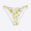 Vit texturerad bikinitrosa med fruktmönster