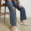 Vita loafers med charmiga rosetter