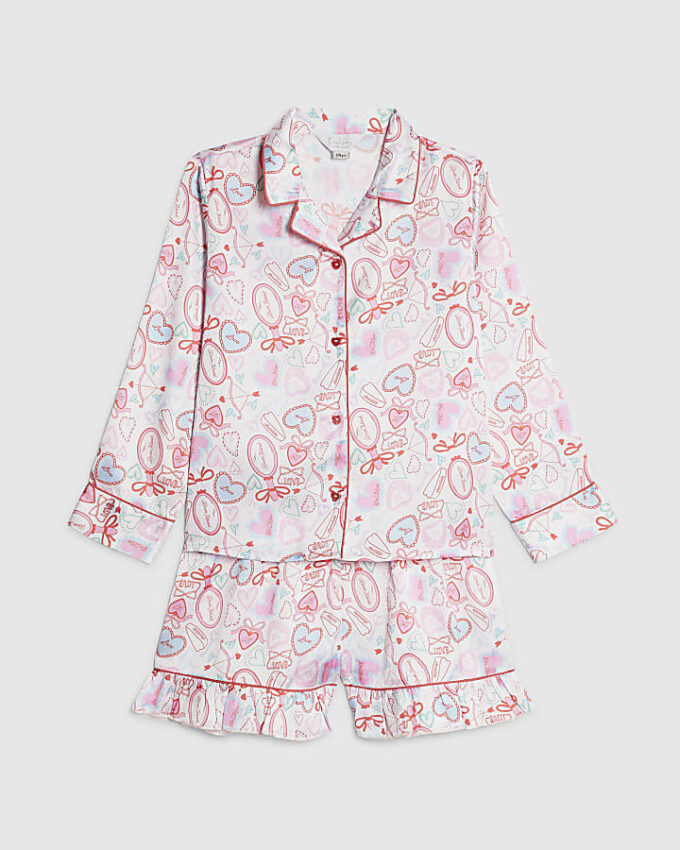 Vita satinpyjamasbyxor med hjärtmönster för flickor Vita satinpyjamasbyxor med hjärtmönster för flickor