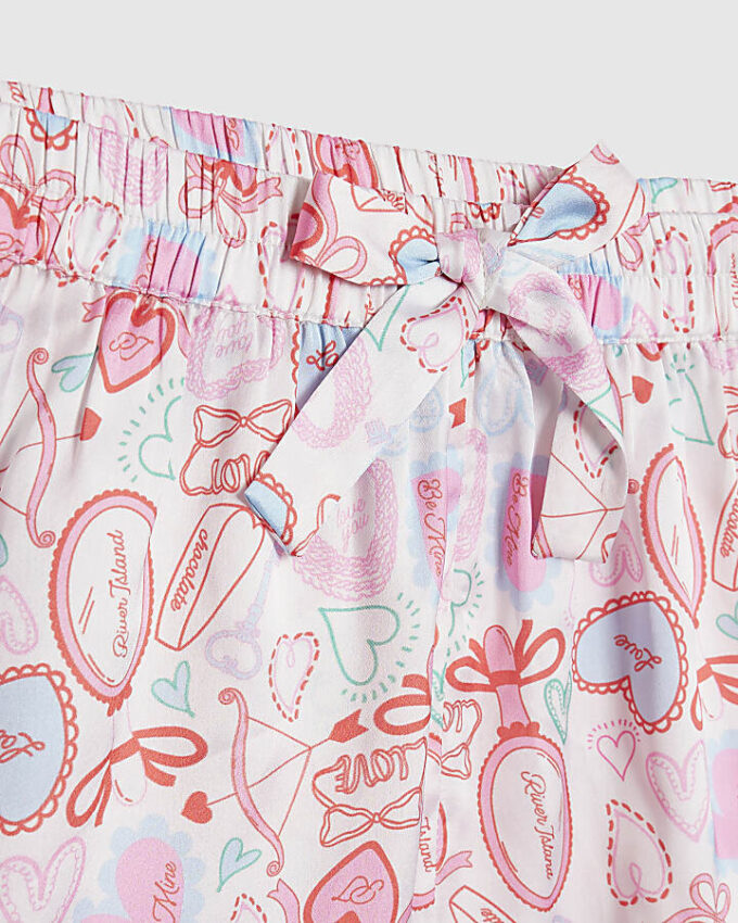 Vita satinpyjamasbyxor med hjärtmönster för flickor Vita satinpyjamasbyxor med hjärtmönster för flickor